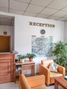 an office with a reception desk and a map on the wall at Forest Sunrise in Samokov