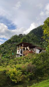 a house on the side of a hill at Casa La Martina disponible en Jardín Antioquia in Jardin