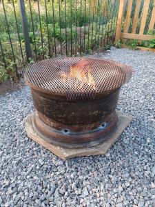 a fire pit sitting on a pile of rocks at The Hut in Ross on Wye