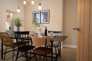 a dining room with a table and chairs with wine glasses at Sea Renity in Whitby
