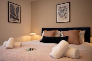 a bedroom with a large bed with white pillows at Sea Renity in Whitby