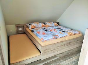 Posteľ alebo postele v izbe v ubytovaní Apartmány Říčky II.