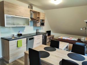 Kuchyňa alebo kuchynka v ubytovaní Apartmány Říčky II.