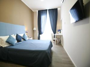 En eller flere senger på et rom på Hotel Magenta + 30 bilder