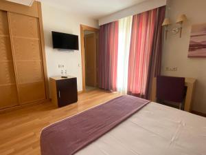 Μια τηλεόραση ή/και κέντρο ψυχαγωγίας στο Hotel Equo Aranjuez