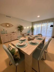 a large wooden table with chairs in a kitchen at AIRE DE SOTOGRANDE in Sotogrande