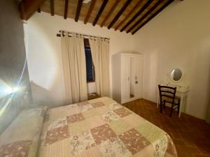 A bed or beds in a room at Agriturismo Podere Casella