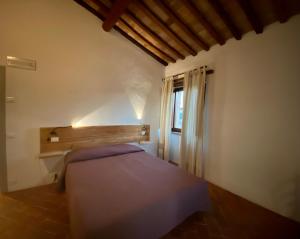 A bed or beds in a room at Agriturismo Podere Casella