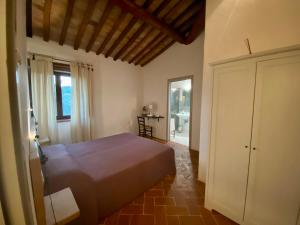 A bed or beds in a room at Agriturismo Podere Casella