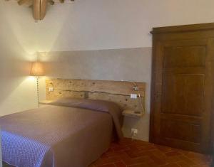 A bed or beds in a room at Agriturismo Podere Casella