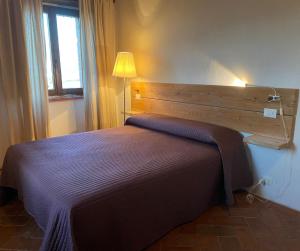 A bed or beds in a room at Agriturismo Podere Casella