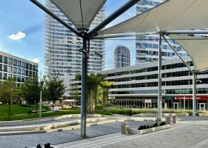 a view of a building in a city with tall buildings at Downtown View in Bratislava