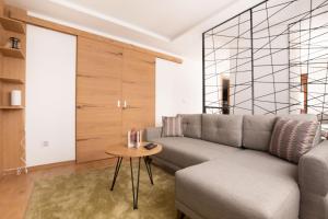 a living room with a couch and a table at ATTIC in Jahorina