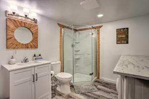 a bathroom with a shower and a toilet and a sink at Lake Arrowhead Cabin with Mid-Century Charm! in Lake Arrowhead +26 photos