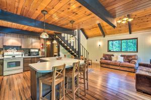a kitchen and living room with a table and chairs at Peaceful Wooded Cabin By Mt. Baker Ski Area! in Glacier