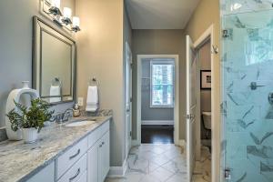 a bathroom with two sinks and a glass shower at Pinehurst Golf Paradise - 2 Mi to Clubhouse! in Pinehurst +24 photos