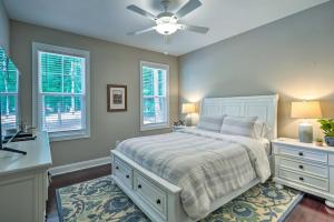 a bedroom with a bed and two windows at Pinehurst Golf Paradise - 2 Mi to Clubhouse! in Pinehurst