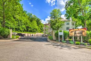 a driveway in front of a house with a sign at Branson Lakefront Condo with Sunroom and Lake Views! in Branson