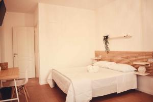 Postel nebo postele na pokoji v ubytování Il Casale dei Calanchi