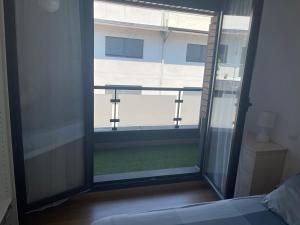 Postel nebo postele na pokoji v ubytování Relájate en Ramales de la Victoria, apartamento con piscina y parking