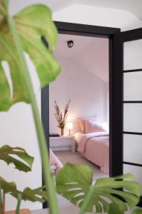 a bedroom with a mirror in front of a bed at Bosco - Łagów lubuski in Łagów
