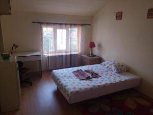 Una cama o camas en una habitación de Apartman Stanimirović