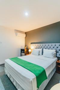 Postel nebo postele na pokoji v ubytování Hotel Hacienda Lima Norte