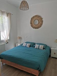 Ένα ή περισσότερα κρεβάτια σε δωμάτιο στο La Petite Etoile