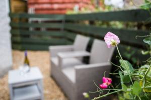 a model of a couch and a pink flower at Ideal Couples base for exploring the Island in Shiskine
