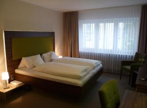 Voodi või voodid majutusasutuse Hotel Kronprinz toas