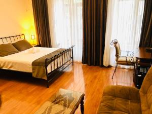 Postel nebo postele na pokoji v ubytování Hotel British House