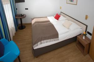 Postel nebo postele na pokoji v ubytování Hotel Aurbacher Hof GmbH