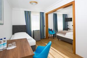 Postel nebo postele na pokoji v ubytování Hotel Aurbacher Hof GmbH