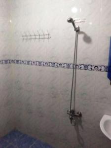 a shower stall in a bathroom with a toilet at Ali Baba complete Apartment Hostel 8Person in Chefchaouen