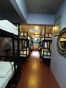 a hallway with several bunk beds in a room at Padua inn in Batu Ferringhi