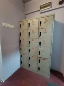 a bunch of lockers in a room with a wall at Padua inn in Batu Ferringhi