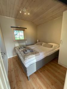 a bedroom with a large bed in a room at Älvstalodges in Jättendal