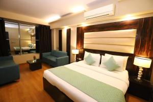 En eller flere senger på et rom på The Palm Spring a Boutique Hotel Naraina New Delhi