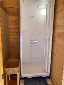 a shower with a glass door in a bathroom at North Villge Hirugano - Vacation STAY 32983v in Gujo
