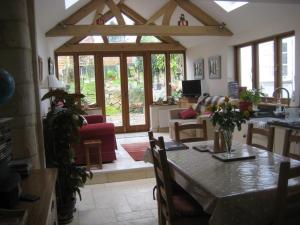 a living room with a table and chairs and a living room at Prospect Cottage in Box