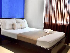 Uma cama ou camas num quarto em Hotel Chico Real