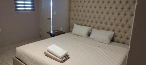 Postel nebo postele na pokoji v ubytování Hermoso Departamento en Cozumel, con vista al mar caribe C9