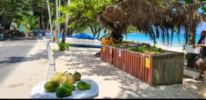 a fruit stand on the side of a beach at Belombre River Villa in Bel Ombre