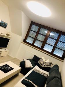Telewizja i/lub zestaw kina domowego w obiekcie KOSI Thermen-Vulkanland Appartement