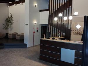 Uma área de estar em Essência Hotel Francisco Beltrão