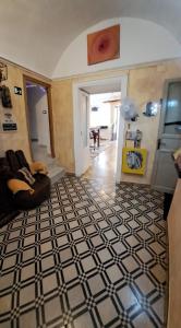 a living room with a black and white floor at Exclusive Dependance in Palermo