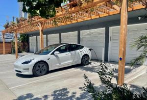 a white car parked in front of a house at Penthouse Two at World Artists Living in Los Angeles