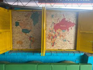 a map of the world projected on a wall at XaviHostel in Bucaramanga