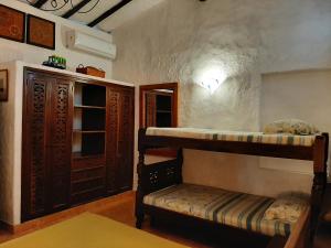 מיטה או מיטות קומותיים בחדר ב-Casa Constantino