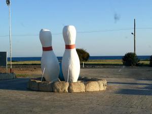 a statue of twoulptures of twoached at PylaApts - Apartments near the beach in Pyla